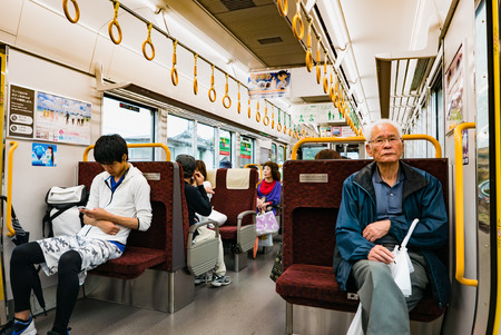 Hiroshima, Japan - May 6, 2016: Interior of local train in Hiroshima, Japan. The local train departure from Miyajimaguchi station to Iwakuni station.のeditorial素材
