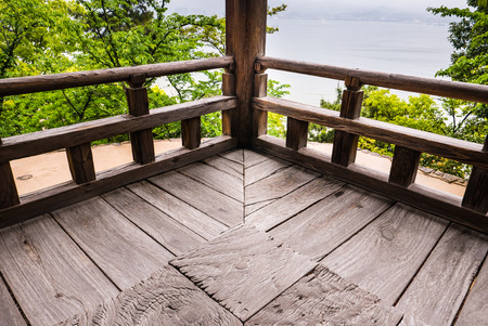 Wooden corner of Senjokaku (Toyokuni Shrine) on Miyajima Island.  Miyajima island is a famous island shrine-town is a UNESCO World Heritage Site and a major tourism destination.のeditorial素材