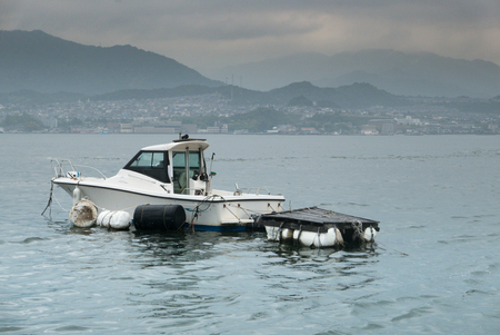 speed boat near Miyajima island, Famous island shrine-town is a UNESCO World Heritage Site and a major tourism destination.の写真素材