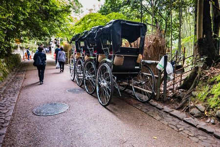 Kyoto, Japan - May 7, 2016: Rickshaw for sightseeing at Bamboo forest of Arashiyama, Kyoto, Japan. Arashiyama is a district on the western outskirts of Kyotoのeditorial素材