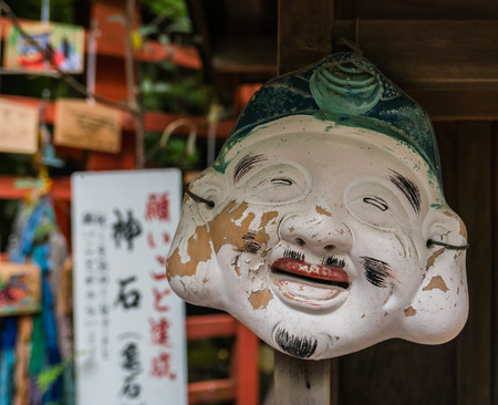 Kyoto, Japan - May 7, 2016: Mask at Nonomiya Shrine, Arashiyama distric, in Kyoto, Japan. Nonomiya shrine is surrounded with a bamboo grove, and it is well known that the Kuroki No Torii (black torii gate).のeditorial素材