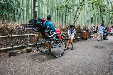 Kyoto, Japan - May 7, 2016: Rickshaw for sightseeing at Bamboo forest of Arashiyama, Kyoto, Japan. Arashiyama is a district on the western outskirts of Kyotoのeditorial素材