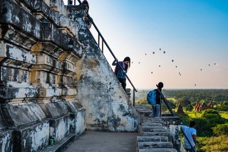Bagan , Myanmar - October 21, 2016: Tourists enjoying the view of Bagan from the top of Shwesandaw Pagoda in morning in Bagan, Myanmarのeditorial素材
