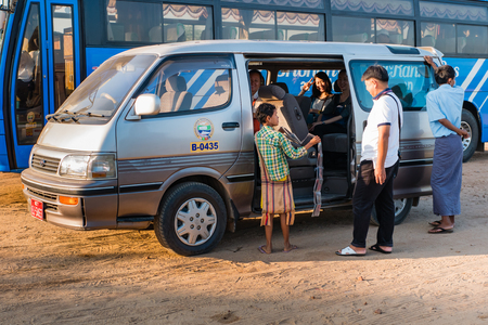 Bagan , Myanmar - October 21, 2016: Burmese girl selling postcards near Shwesandaw Pagoda in Bagan, Myanmarのeditorial素材