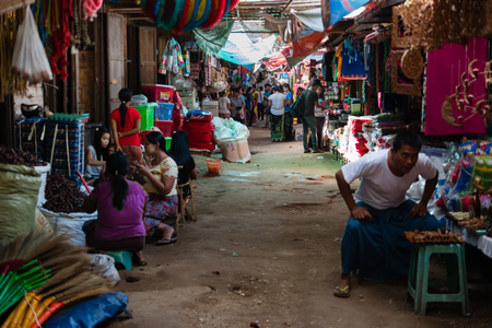 Bagan , Myanmar - October 21, 2016: Burmese people working at Mani Sithu Market in Nyaung-U village, Bagan, Myanmar (Burma)のeditorial素材