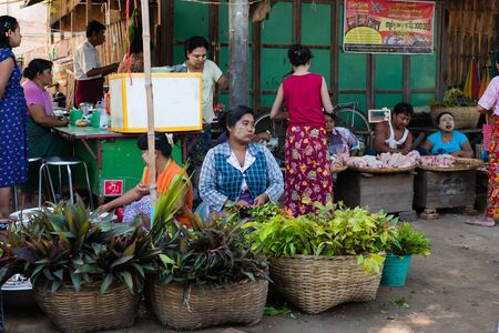 Bagan , Myanmar - October 21, 2016: Burmese People at Mani Sithu Market in Nyaung-U village, Bagan, Myanmar (Burma)のeditorial素材