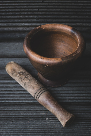 Mortar and pestle on wooden backgroundの写真素材