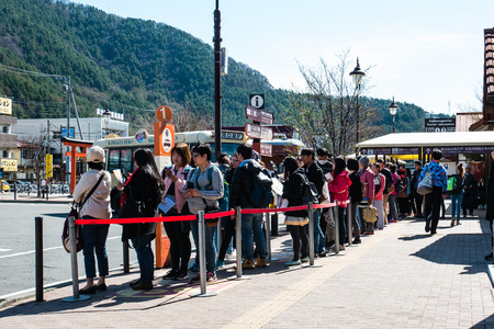Kawaguchi, Japan - April 20, 2017: Tourists waiting for bus at Kawaguchiko station  is a railway...