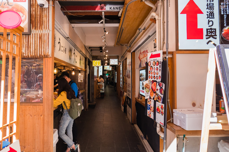 Tokyo, Japan - October 30, 2018: Restaurants in Tsukiji Fish Market in Tokyo, Japan. It is the biggest wholesale fish and seafood market in the world.のeditorial素材