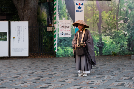 Tokyo, Japan - October 31, 2018: Unidentified Japnese monk in front of Meiji-jingu shrine in Shibuya, Tokyo, Japan.のeditorial素材