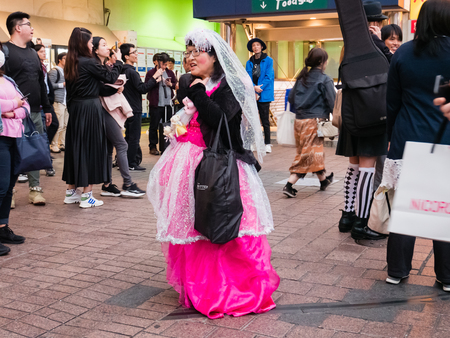 Tokyo, Japan - October 31, 2018: Shibuya station and crossing area is crowded with people wearing Halloween costumes on October 31, 2018のeditorial素材