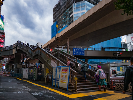 Tokyo, Japan - October 31, 2018: People crossing steet by pedestrian overpass in Shibuya Tokyo, Japanのeditorial素材