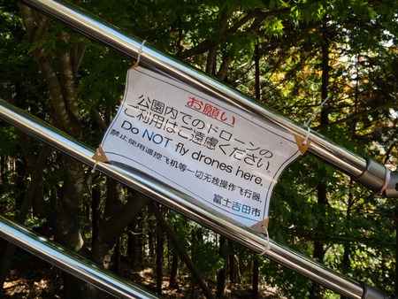 Kawaguchi, Japan - November 1, 2018: Do not fly drones sign near to Chureito Pagoda in Fujiyoshida, Yamanashi Prefecture.のeditorial素材