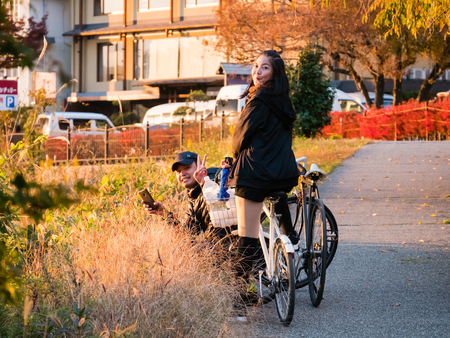 Kawaguchi, Japan - November 1, 2018: Tourist with bicycle near lake Kawaguchi, Japan for sightseeing.のeditorial素材