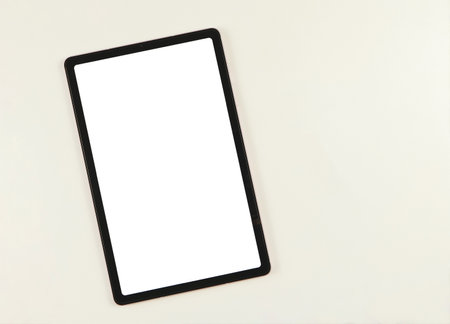 Top view or flat lay of digital tablet with blank white screen  isolated on white background.の写真素材