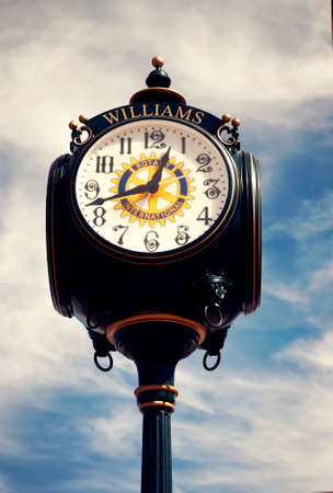 Clock in Williams, AZ on Route 66 with cloudy sky backgroundの写真素材