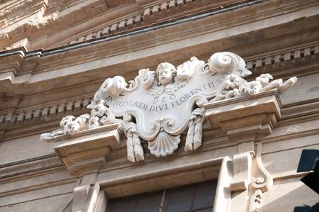 Florence, Italy-October 22, 2013: Ornate sign decorates a doorway in Florence, Italy. The sign was a dedication.のeditorial素材