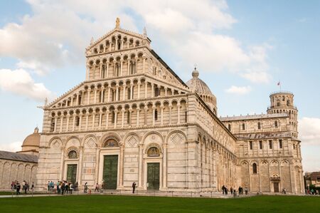 Pisa, Italy-October 22, 2013: The  Santa Maria Assunta Basilica and the Leaning Tower are tourist attractions at Pisa Tuscany, Italyのeditorial素材