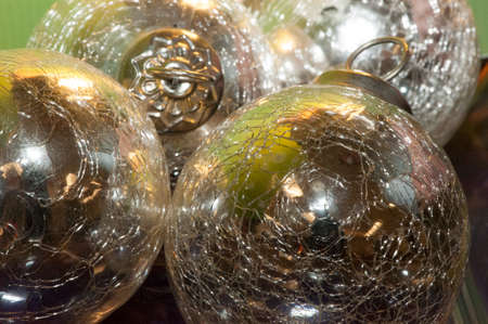 Multicolored reflections in shiny silver orbs or Christmas ornaments are viewed close-up and grouped together.の写真素材
