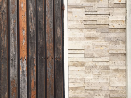 Wood wall and bricks wall background at the same placeの写真素材