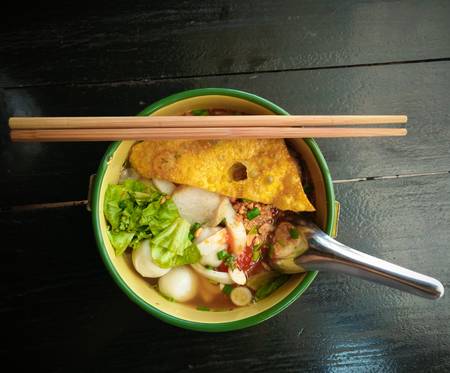 Noodles with fish balls in bowlの写真素材