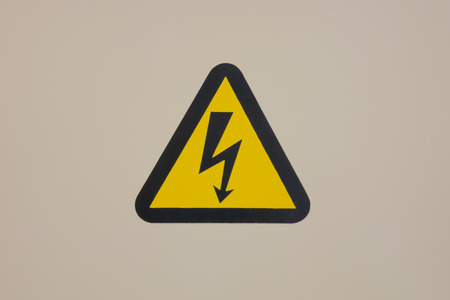 high voltage warning sign on high-voltage substationの写真素材