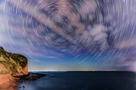 Starry sky from Chiba marital rock (comparison of star traces)の写真素材