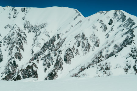 Winter mountain landscape with snow and blue sky. Caucasus Mountains, Georgia, region Gudauri.の写真素材