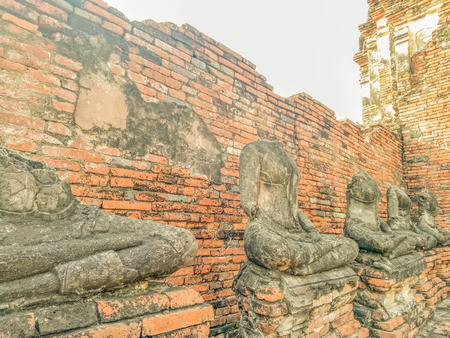Buddha statue no head Wat Chaiwatthanaram temple in Ayuthaya Historical Parkの写真素材