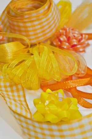 Colorful yellow ribbons and bowsの写真素材