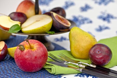 Fresh autumn fruits in a vintage bowlの写真素材