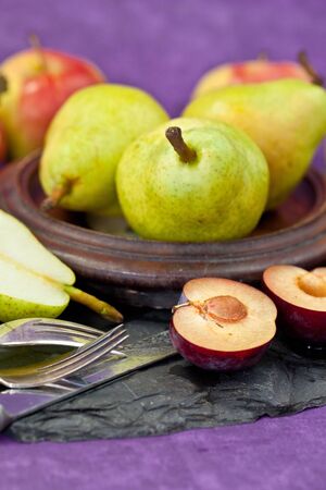 Fresh autumn fruit in a vintage bowlの写真素材