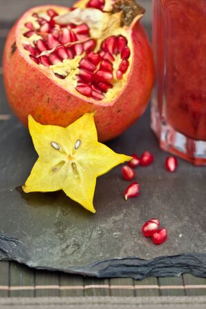 Two glasses with a red cocktail and pomegranateの写真素材