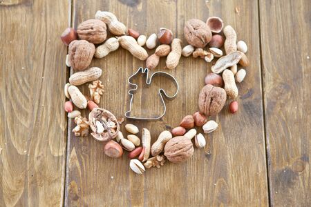 Various nuts arranged in a heart shapeの写真素材