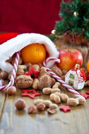Christmas stocking filled with fruit and nutsの写真素材