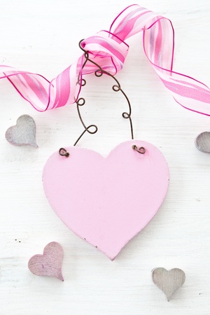 White wooden background with heartの写真素材