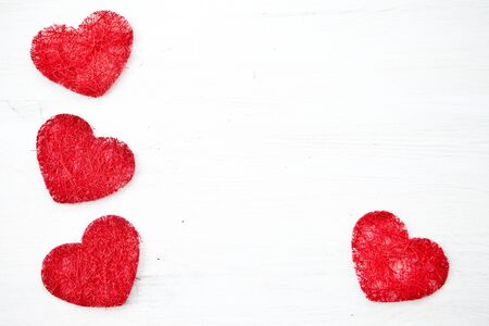 White wooden background with hearts