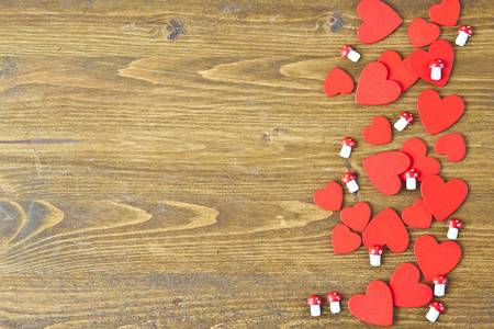 Wooden background with heartsの写真素材