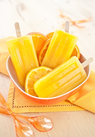 Homemade orange ice popsiclesの写真素材