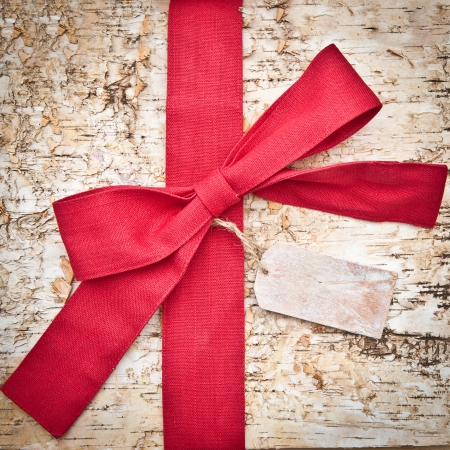 Wooden background made of birch with a big red bowの写真素材