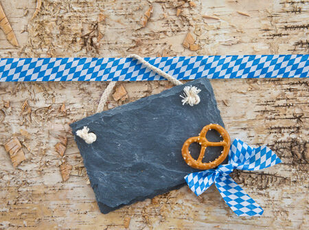 Rustic background with bavarian white and blue ribbonの写真素材