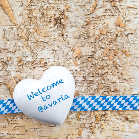 Rustic background with bavarian white and blue ribbonの写真素材