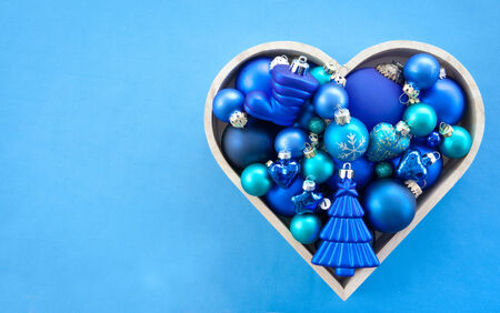 Blue christmas baubles arranged in a tree shapeの写真素材