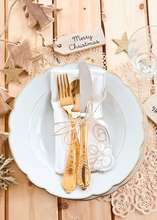Vintage table ware placed for a festive christmas dinnerの写真素材