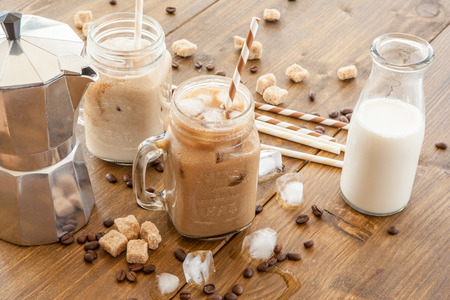 Iced coffee with milk in vintage jarの写真素材