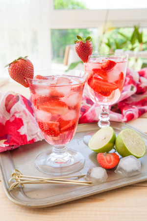 Homemade strawberry lemonade or sangria with fresh limeの写真素材