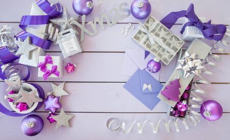 Christmas background with purple xmas ornaments and baublesの写真素材