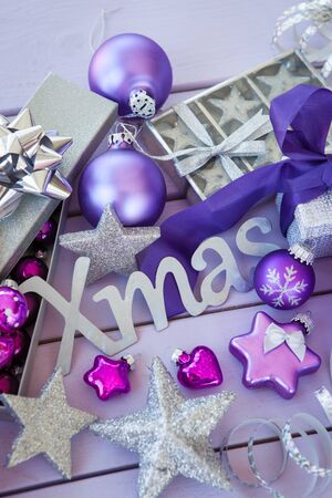 Christmas background with purple xmas ornaments and baublesの写真素材