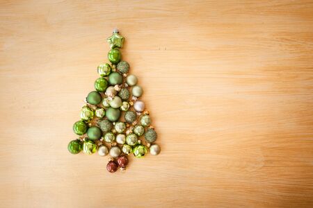 Christmas background with xmas ornaments and baubles in tree shapeの写真素材