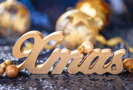 Festive christmas decorations on shiny background with sequinsの写真素材